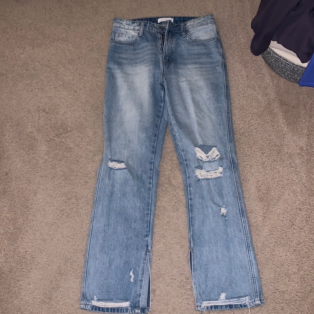 Never worn distressed jeans